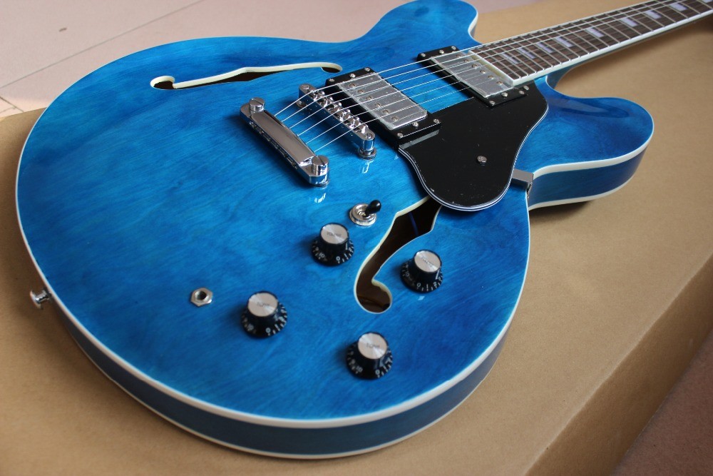 High quality electric guitar in blue color hollow body with chrome hardware