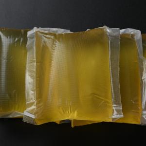 China High Quality Design Yellow Eva Based Hot Melt Bonding Glue For Fruit Carton on sale