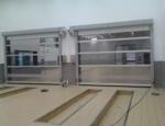 Aluminum Alloy Glass Sectional Door For Villa Customized Transparent