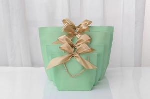 Wholesale Stamping Logo Light Green Cosmetic Shopping Bag Bow Tie Ribbon White Gift Bag from china suppliers
