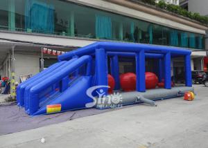 China Outdoor double lane adults interactive inflatable assault course with big bouncing balls on sale