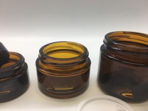 Wholesale Transparent Cosmetic Refill Amber Glass Jar Straight Round Shape With Plastic Black Lid from china suppliers