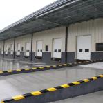 Sectional doors open vertically and are suspended under the ceiling, that the