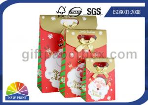 China Customized Christmas Gift Packaging Bag with Die Cut Handles Ribbon Bowknot on sale